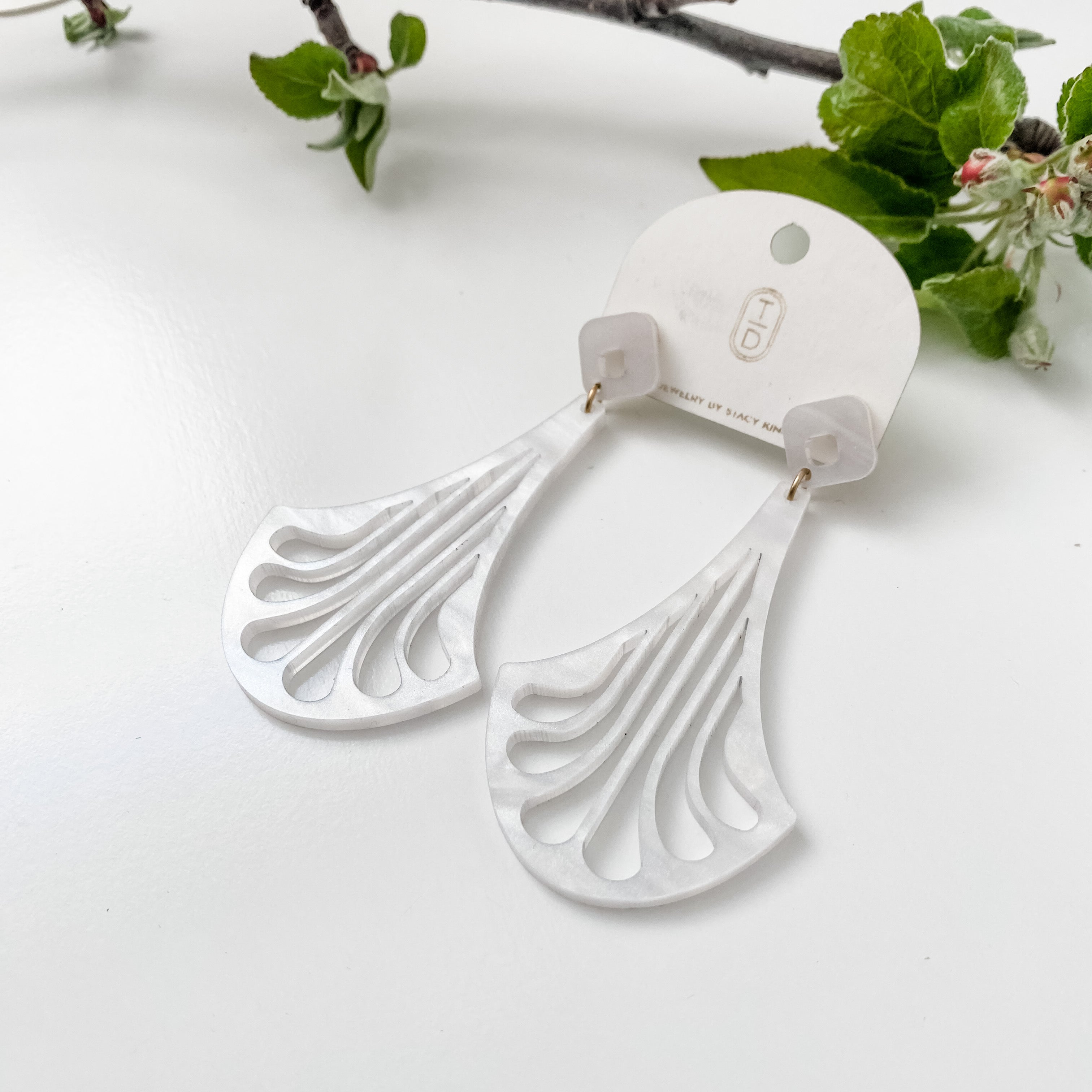 Erté Neo-Deco drop earrings in pearl acrylic