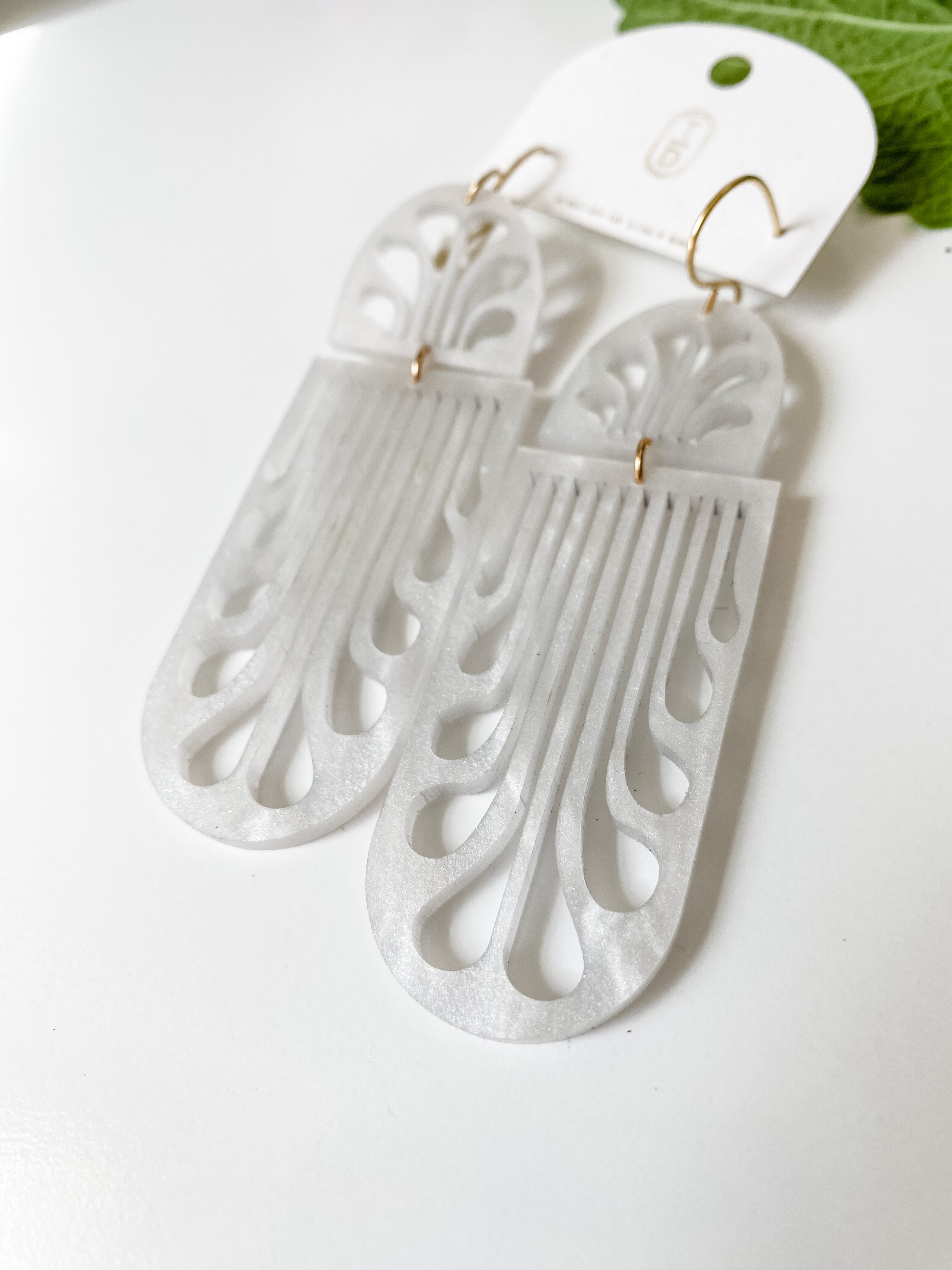 Erté Reflecting Arches Earrings in white, pearl sheen acrylic